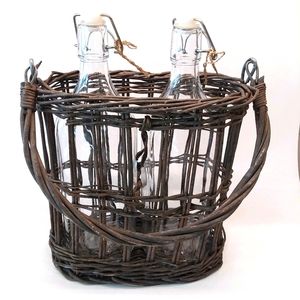 2 clear vtg style bottles in a carry basket retro